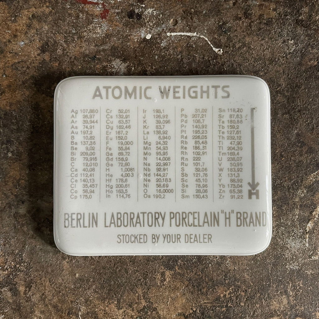 A rare pre 1938 Antique Porcelain Slab measuring 12.5 x 10.5 cm listing 5 columns of Atomic Weights by the German makers D.R.G.M.  The Porcelain Slab is in excellent condition for its age with clear unfaded text - SHOP NOW - www.intovintage.co.uk