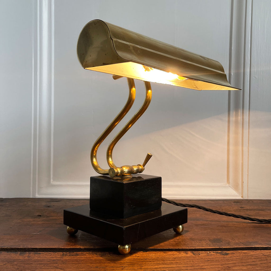 A smart looking Brass and fully adjustable Bankers Lamp with two stepped black marble base and brass bun feet. The lamp has been rewired with new material covered black cord and plug - SHOP NOW - www.intovintage.co.uk