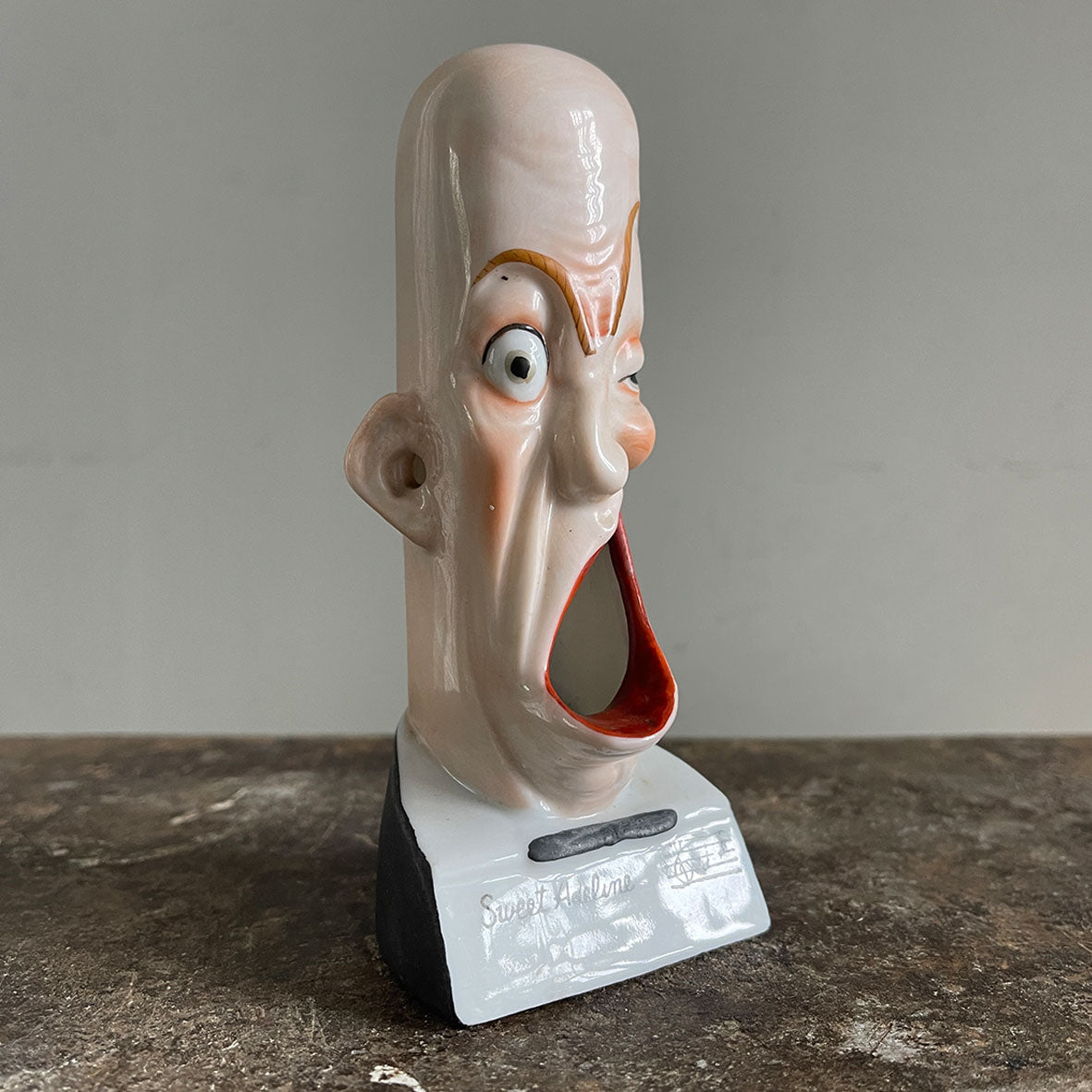 A rare German Porcelain Smoking Ashtray by Schafer &amp; Vater. These unusual objects were used as ashtrays with the smoke of the cigarette escaping through the ear holes. This one sees an old ugly chap with a big old eye and a title that reads 'Sweet Adeline' - SHOP NOW - www.intovintage.co.uk