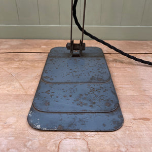 A great looking 1950's Industrial Lamp. Finished in a battleship grey with fantastic patina to its painted surfaces. it has a stepped base with fixing hole so that it can be mounted on a wall or just on a desk  - SHOP NOW - www.intovintage.co.uk