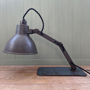 A great looking 1950's Industrial Lamp. Finished in a battleship grey with fantastic patina to its painted surfaces. it has a stepped base with fixing hole so that it can be mounted on a wall or just on a desk  - SHOP NOW - www.intovintage.co.uk
