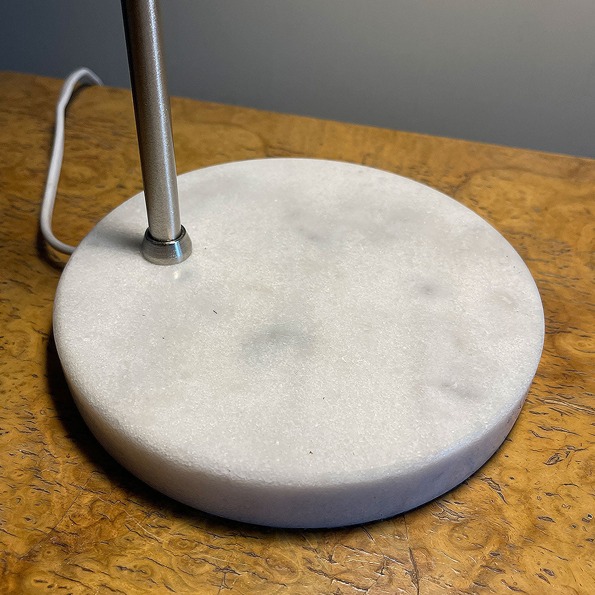 A stylish Carlo Task Lamp with contrasting brushed aluminium metal work with a grey marble base. The lamp head is adjustable and can be positioned in an up or down position - SHOP NOW - www.intovintage.co.uk