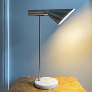 A stylish Carlo Task Lamp with contrasting brushed aluminium metal work with a grey marble base. The lamp head is adjustable and can be positioned in an up or down position - SHOP NOW - www.intovintage.co.uk