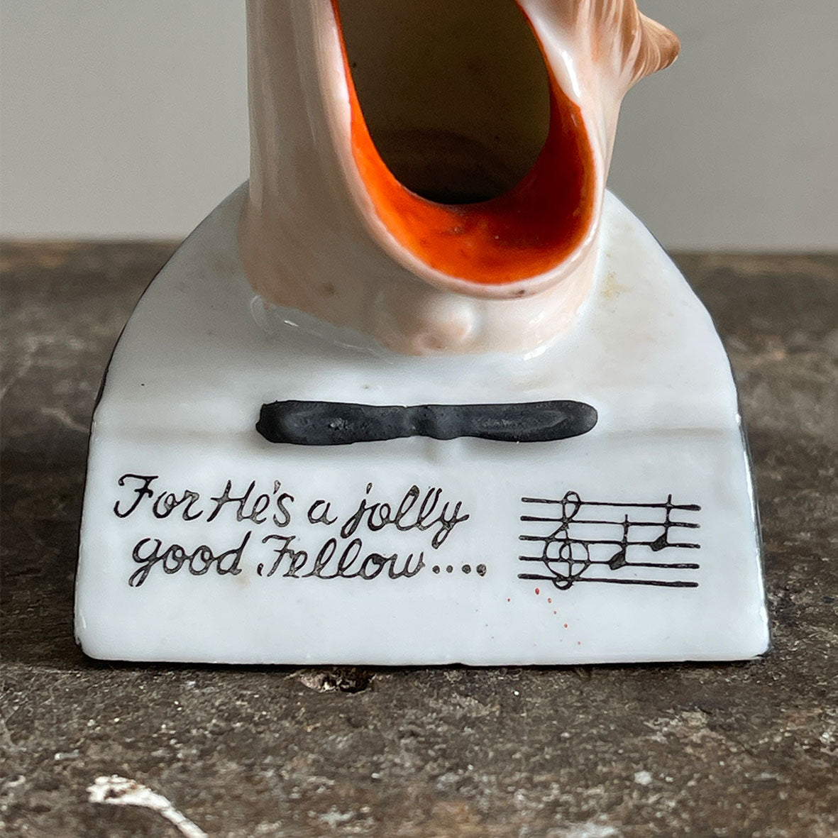 A rare German Porcelain Smoking Ashtray by Schafer &amp; Vater. These unusual objects were used as ashtrays with the smoke of the cigarette escaping through the ear holes. This one sees an old ugly chap with a monocle and a title that reads 'For He's a jolly good fellow - SHOP NOW - www.intovintage.co.uk