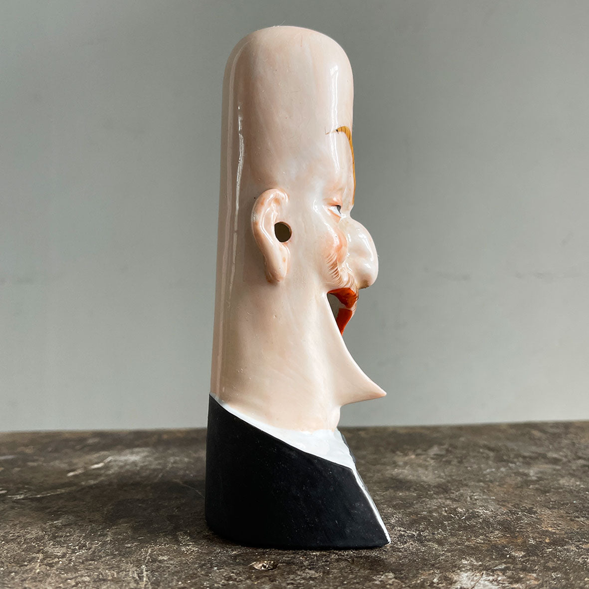 A rare German Porcelain Smoking Ashtray by Schafer &amp; Vater. These unusual objects were used as ashtrays with the smoke of the cigarette escaping through the ear holes. This one sees an old ugly chap with a monocle and a title that reads 'For He's a jolly good fellow - SHOP NOW - www.intovintage.co.uk