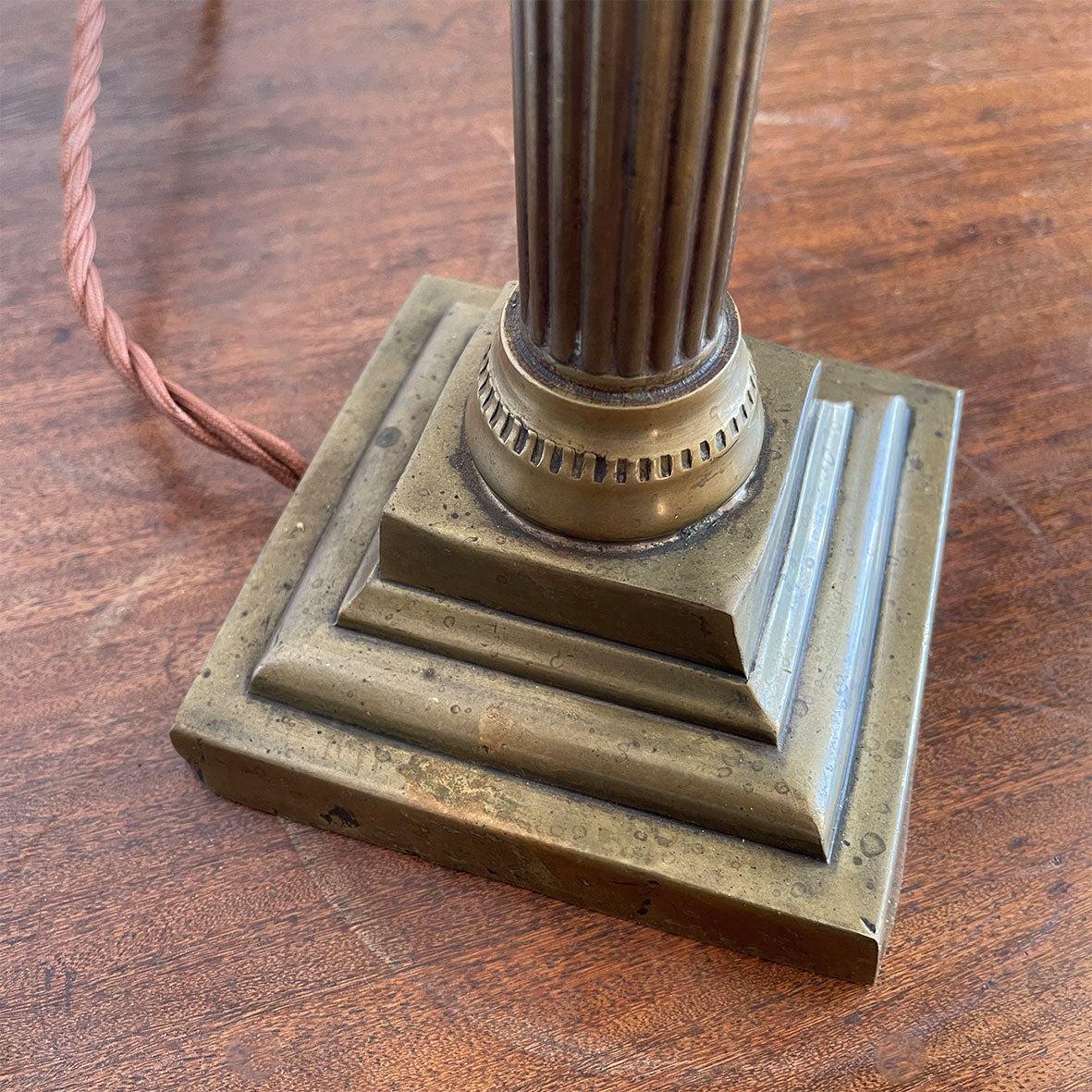 An interesting Gothic Brass Table Lamp with coat of arms to the front. The lamp sits a-top a brass fluted column base with swan neck. Wired for electricity with antique fabric covered cable, new plug and pat tested. - SHOP NOW - www.intovintage.co.uk