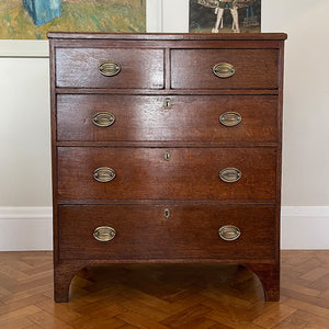 An impressive late 18th early 19th century oak chest of drawers. Constructed from solid oak with pine sides with a beautiful aged rich patina. Fitted with two over three drawers each with fine dovetailed jointing, and mounted with good quality brass handles - SHOP NOW - www.intovintage.co.uk