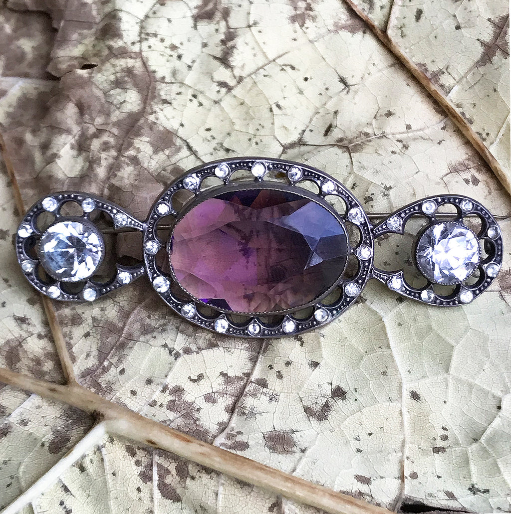 Beautiful quality Victorian brooch with a pale purple cut glass centre gem that is surrounded by a fabulous cut glass diamond studded border with two larger cut glass diamonds at each end - SHOP NOW - www.intovintage.co.uk