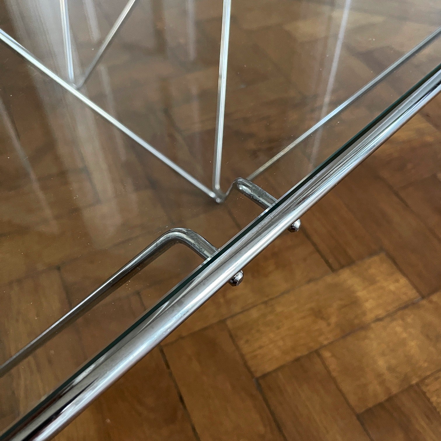 A stylish modernistic chromed square vintage coffee table in the Style of Paolo Piva circa 1980, Italy.Simple and elegant in form, the frame is made of chromed steel shaped connected triangles. Clear glass top - SHOP NOW - www.intovintage.co.uk