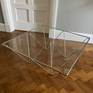 A stylish modernistic chromed square vintage coffee table in the Style of Paolo Piva circa 1980, Italy.Simple and elegant in form, the frame is made of chromed steel shaped connected triangles. Clear glass top - SHOP NOW - www.intovintage.co.uk