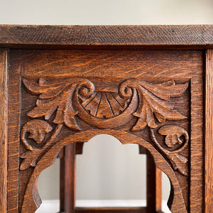 A good looking Carved Oak Side Table. The hexagonal top sees a beautiful hand-carved decorative leaf border with further carving to each of the six side panels. 