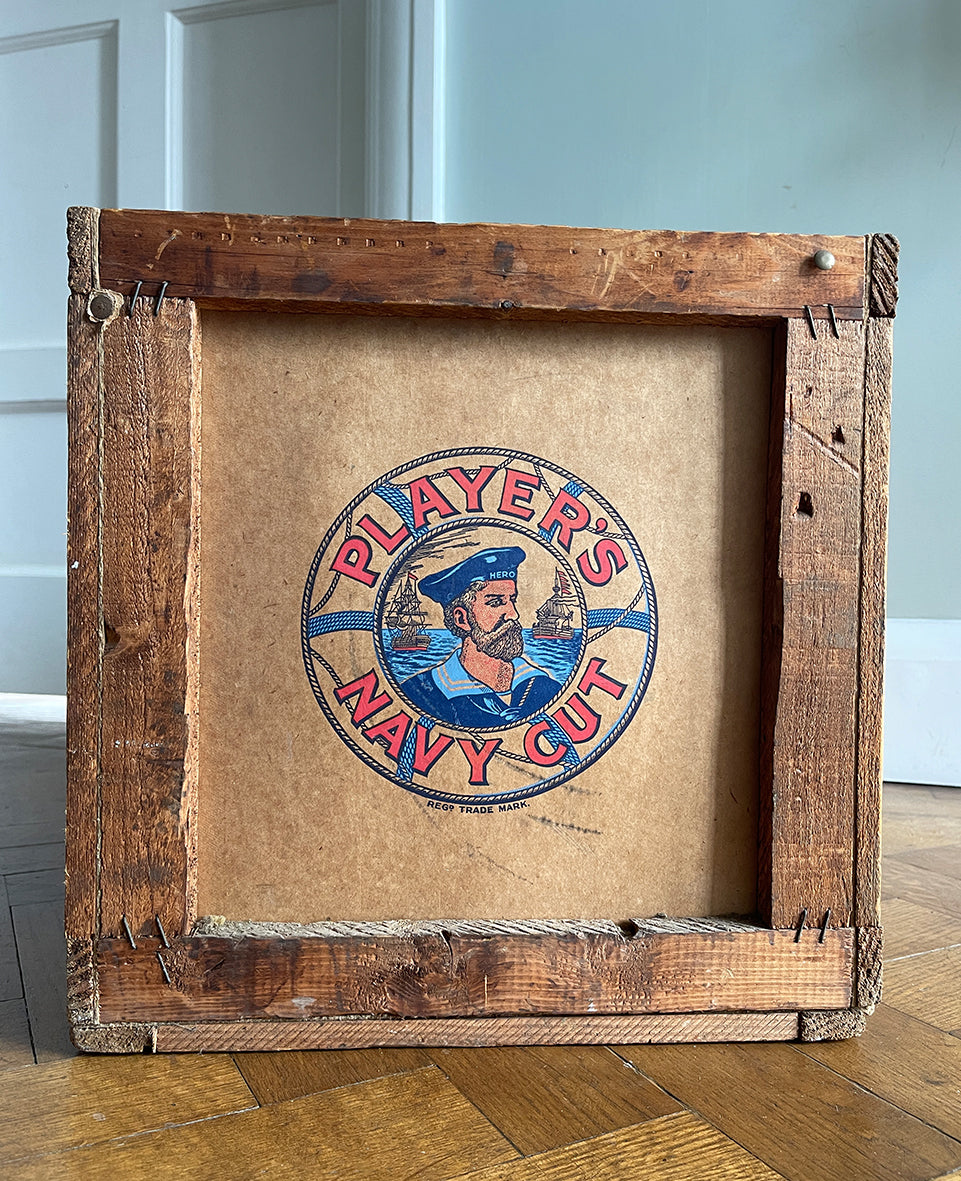 A 1950s Players Airman's Cigarettes Delivery Crate in excellent condition. With the Player's Airman logo to the main sides panels and the Player's Navy Cut logo on one of the end panels. The opposite end has the original delivery label still stuck to it. Great for general storage or a cool log box for beside the fire - SHOP NOW - www.intovintage.co.uk