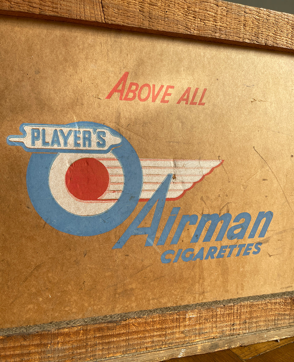 A 1950s Players Airman's Cigarettes Delivery Crate in excellent condition. With the Player's Airman logo to the main sides panels and the Player's Navy Cut logo on one of the end panels. The opposite end has the original delivery label still stuck to it. Great for general storage or a cool log box for beside the fire - SHOP NOW - www.intovintage.co.uk