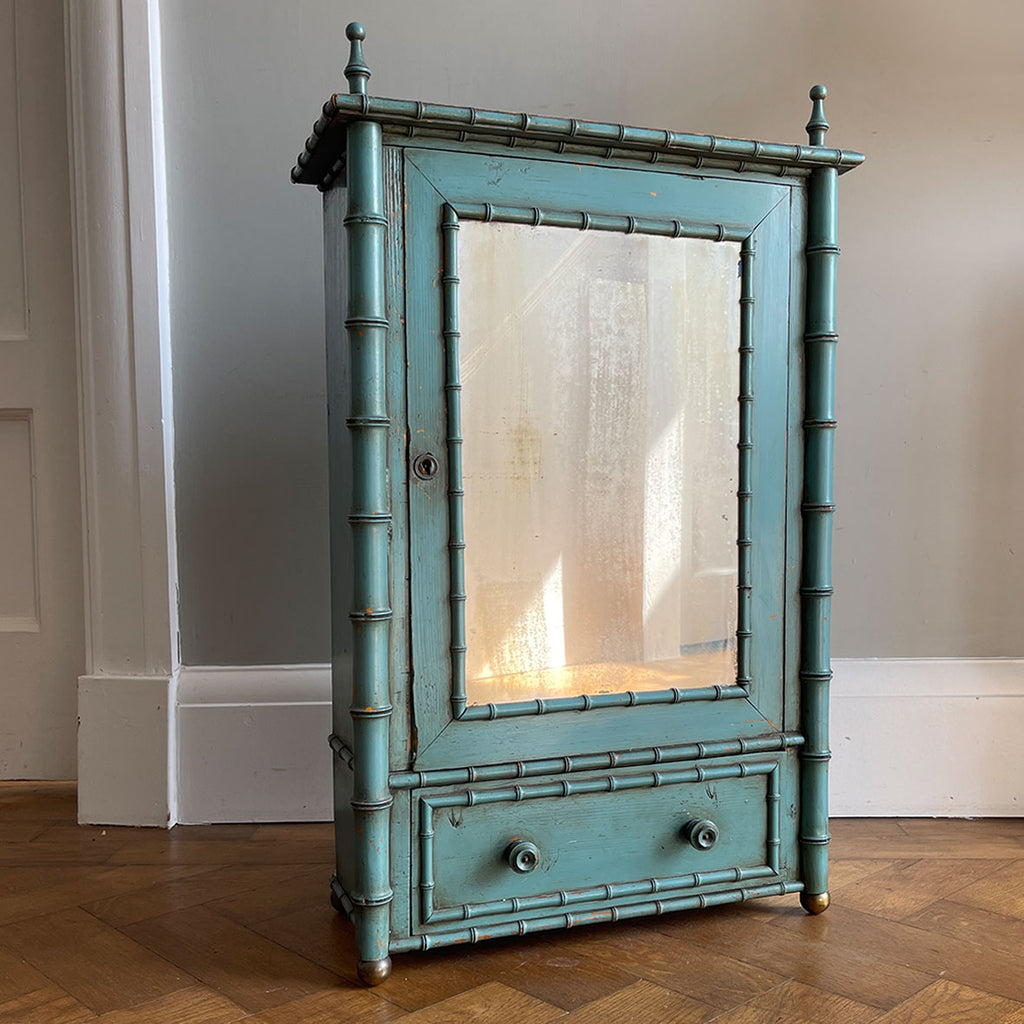 A Pretty Chinese inspired Wall Cabinet in its original paint and with original mirror plate. The cabinet is Chinese inspired, with bamboo edge detailing, golden globe feet and turned finials on top. It is finished in a beautiful and perfectly aged duck egg blue, and the original mirror plate - SHOP NOW - www.intovintage.co.uk