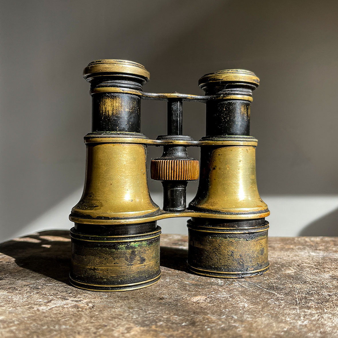 A pair of Victorian Negretti and Zambra binoculars. Made from brass and have a patinated black finish to the brass that has worn away over the years.The mark of NEGRETTI & ZAMBRA -OPTICIANS TO THE QUEEN appears around the rim of one of the eye pieces and 'ADJUSTED IN LONDON' around the other. - SHOP NOW - www.intovintage.co.uk