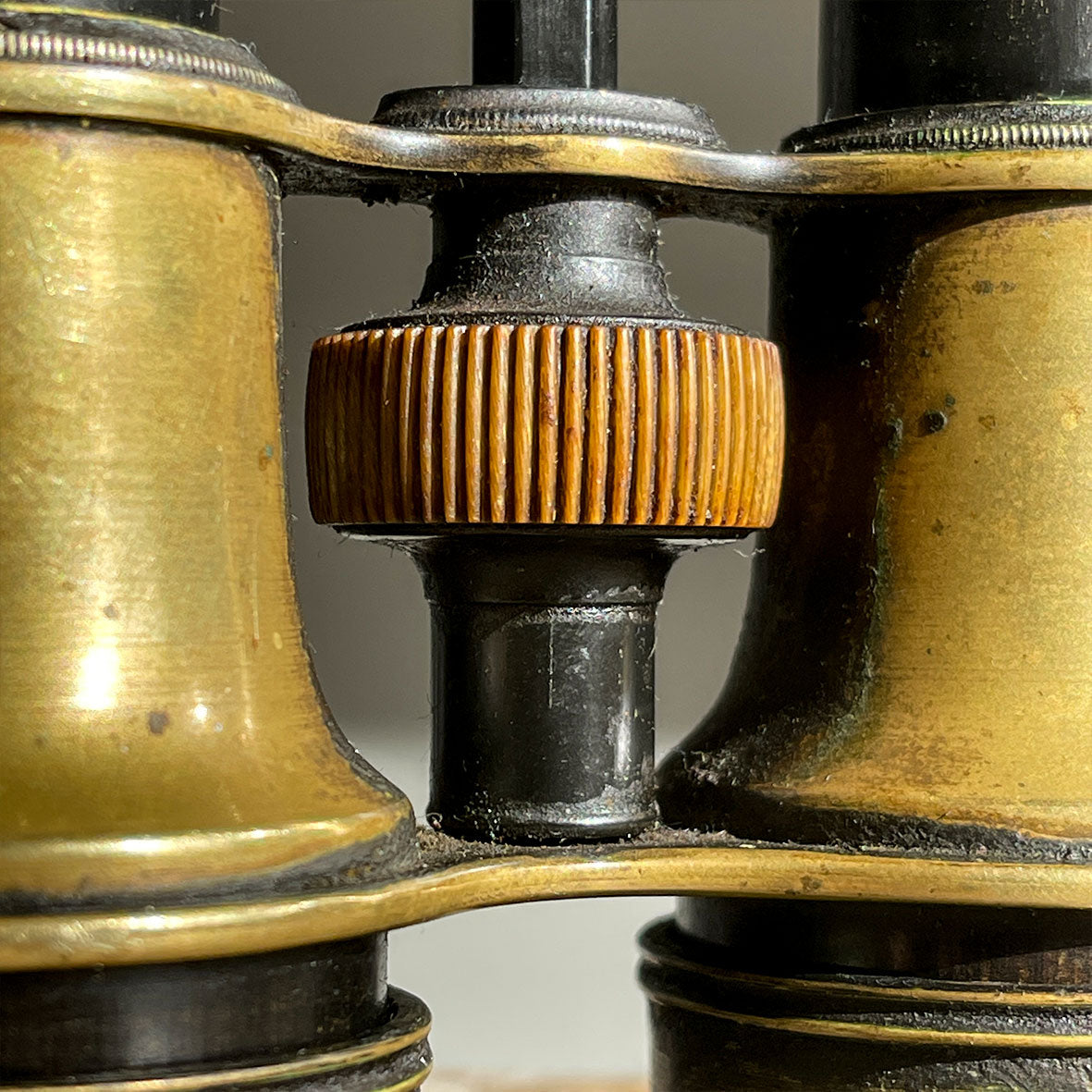 A pair of Victorian Negretti and Zambra binoculars. Made from brass and have a patinated black finish to the brass that has worn away over the years.The mark of NEGRETTI & ZAMBRA -OPTICIANS TO THE QUEEN appears around the rim of one of the eye pieces and 'ADJUSTED IN LONDON' around the other. - SHOP NOW - www.intovintage.co.uk