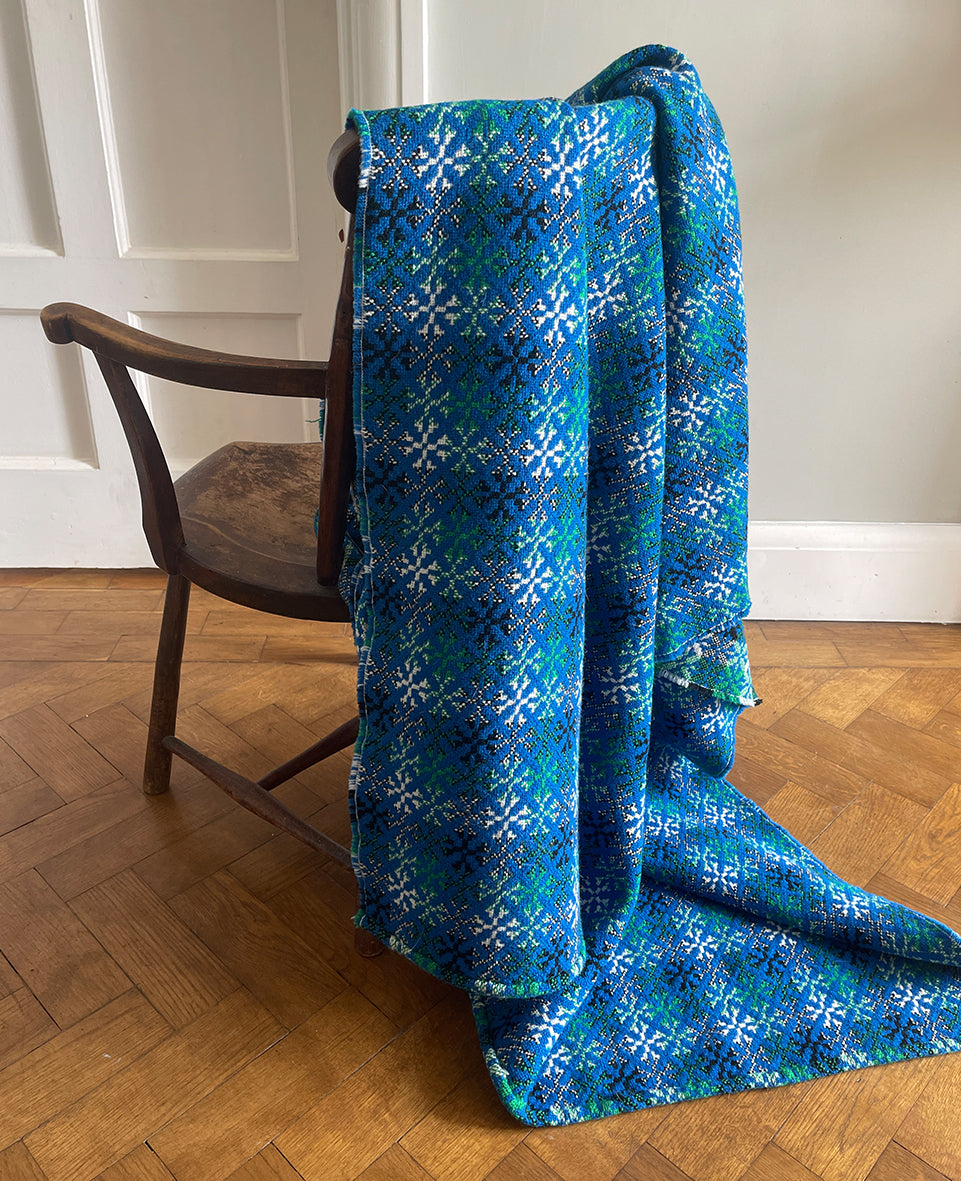 A pure wool Welsh Tapestry blanket in Blue, Aqua Green, white and Black - SHOP NOW - www.intovintage.co.uk