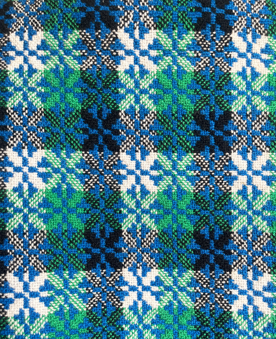 A pure wool Welsh Tapestry blanket in Blue, Aqua Green, white and Black - SHOP NOW - www.intovintage.co.uk