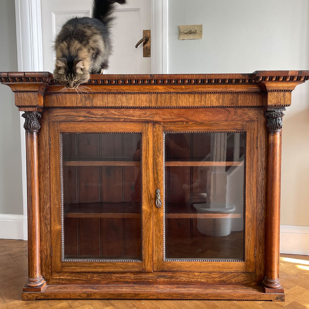 A good looking Victorian Rosewood Bookcase. Two original glazed doors are framed by a classical egg & dart cornice freeze to the top and two decorative solid rosewood columns each side - SHOP NOW - www.intovintage.co.uk