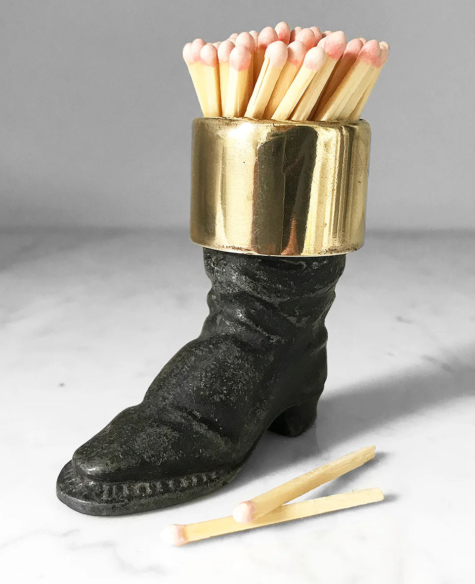 Well modelled Victorian vesta case of an old boot. Cast from metal with a brass cuff it has a striker on its sole to light your match - SHOP NOW - www.intovintage.co.uk
