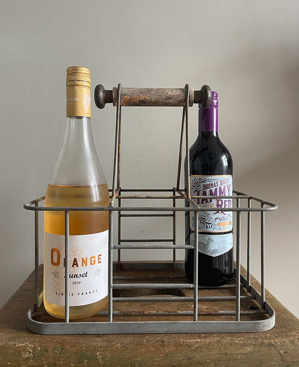 A vintage French bottle holder with wooden handle- perfect for storing all sorts of bottles and even milk if you still have it delivered! Nice decoration to the ends of the handles - SHOP NOW - www.intovintage.co.uk