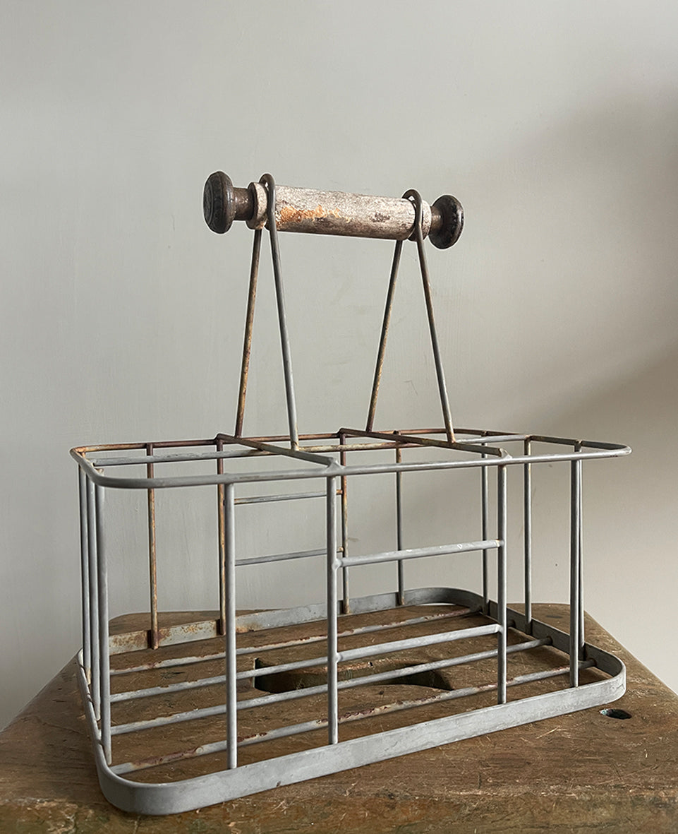 A vintage French bottle holder with wooden handle- perfect for storing all sorts of bottles and even milk if you still have it delivered! Nice decoration to the ends of the handles - SHOP NOW - www.intovintage.co.uk