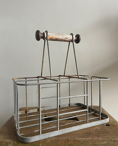 A vintage French bottle holder with wooden handle- perfect for storing all sorts of bottles and even milk if you still have it delivered! Nice decoration to the ends of the handles - SHOP NOW - www.intovintage.co.uk