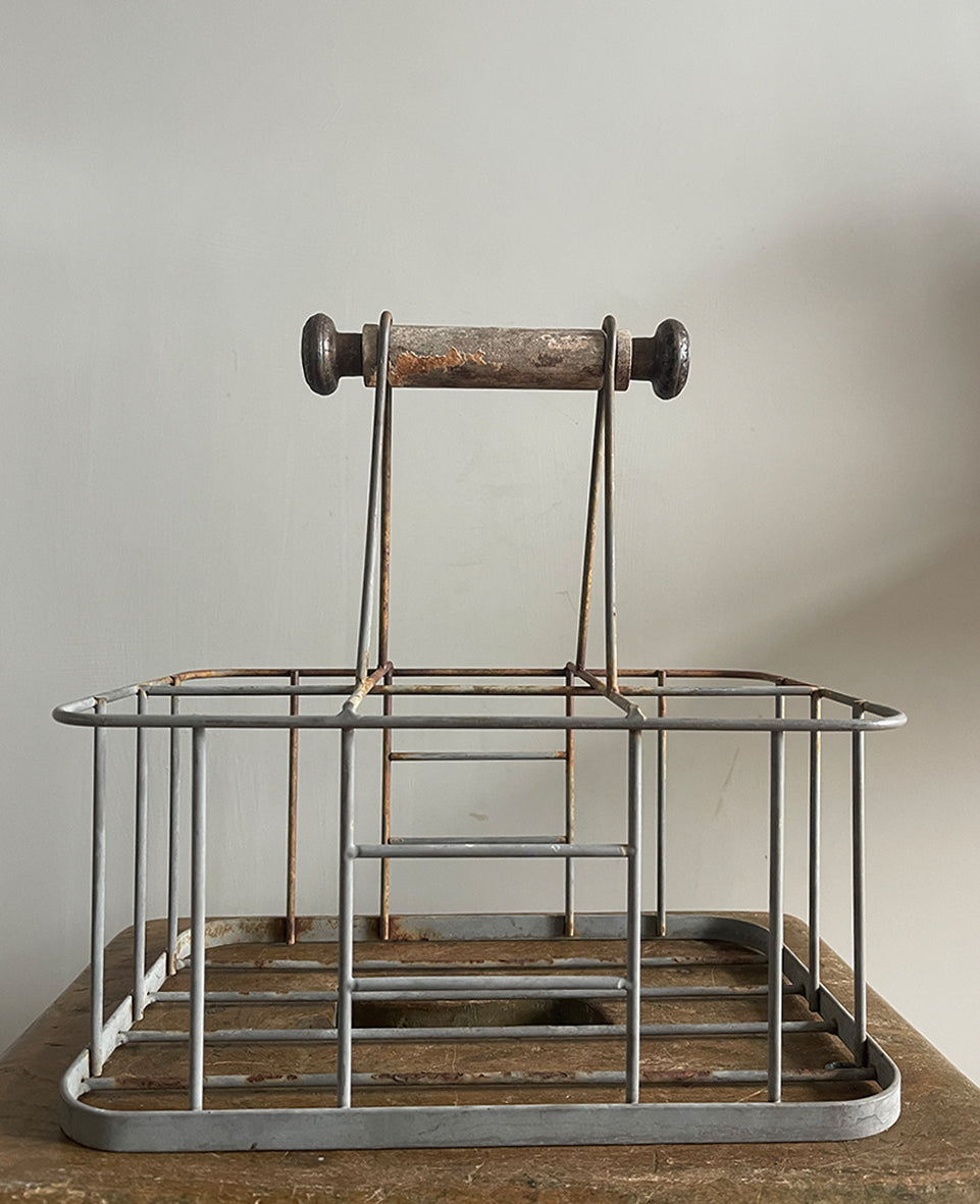 A vintage French bottle holder with wooden handle- perfect for storing all sorts of bottles and even milk if you still have it delivered! Nice decoration to the ends of the handles - SHOP NOW - www.intovintage.co.uk
