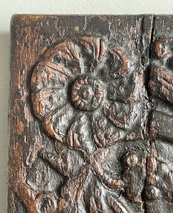 An interesting 17th Century Carved Oak Panel that once would have been the door off of a piece of furniture. The hinge and escutcheon marks are still visible on the reverse. The center sees a crowned eagle surrounded by climbing roses with four larger roses in each corner. Look closer and you'll see other birds and a cupid within the foliage - SHOP NOW - www.intovintage.co.uk