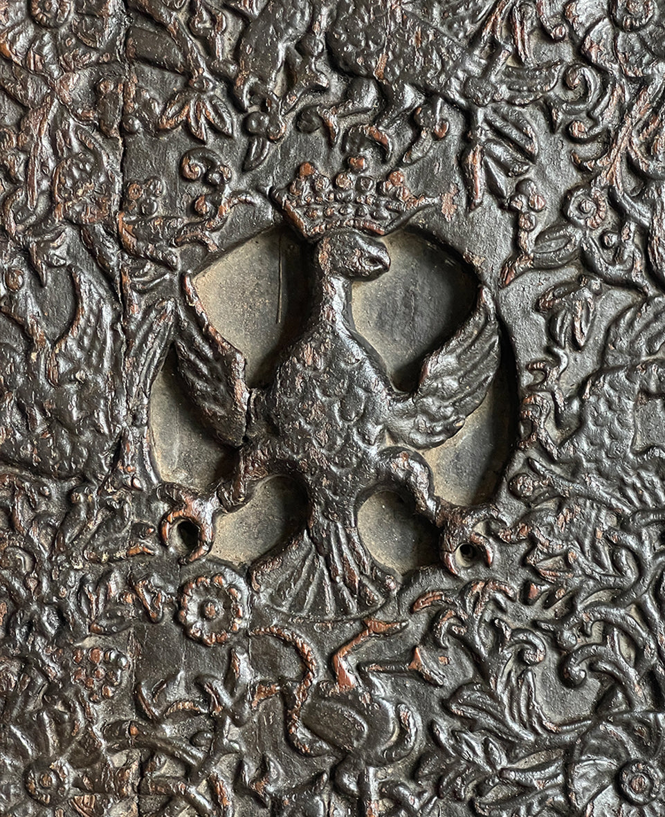 An interesting 17th Century Carved Oak Panel that once would have been the door off of a piece of furniture. The hinge and escutcheon marks are still visible on the reverse. The center sees a crowned eagle surrounded by climbing roses with four larger roses in each corner. Look closer and you'll see other birds and a cupid within the foliage - SHOP NOW - www.intovintage.co.uk