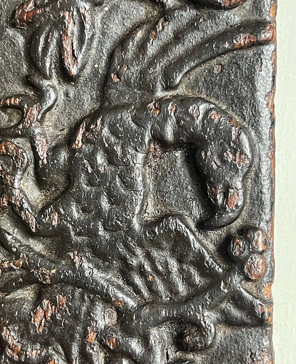 An interesting 17th Century Carved Oak Panel that once would have been the door off of a piece of furniture. The hinge and escutcheon marks are still visible on the reverse. The center sees a crowned eagle surrounded by climbing roses with four larger roses in each corner. Look closer and you'll see other birds and a cupid within the foliage - SHOP NOW - www.intovintage.co.uk
