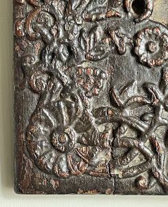 An interesting 17th Century Carved Oak Panel that once would have been the door off of a piece of furniture. The hinge and escutcheon marks are still visible on the reverse. The center sees a crowned eagle surrounded by climbing roses with four larger roses in each corner. Look closer and you'll see other birds and a cupid within the foliage - SHOP NOW - www.intovintage.co.uk