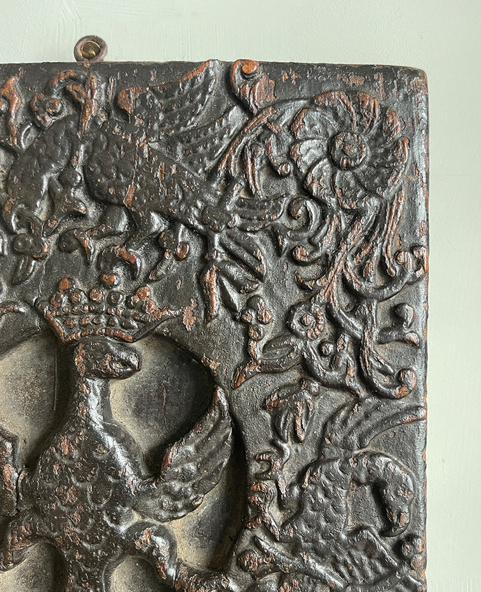 An interesting 17th Century Carved Oak Panel that once would have been the door off of a piece of furniture. The hinge and escutcheon marks are still visible on the reverse. The center sees a crowned eagle surrounded by climbing roses with four larger roses in each corner. Look closer and you'll see other birds and a cupid within the foliage - SHOP NOW - www.intovintage.co.uk