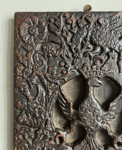 An interesting 17th Century Carved Oak Panel that once would have been the door off of a piece of furniture. The hinge and escutcheon marks are still visible on the reverse. The center sees a crowned eagle surrounded by climbing roses with four larger roses in each corner. Look closer and you'll see other birds and a cupid within the foliage - SHOP NOW - www.intovintage.co.uk