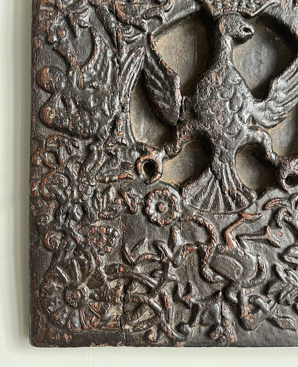 An interesting 17th Century Carved Oak Panel that once would have been the door off of a piece of furniture. The hinge and escutcheon marks are still visible on the reverse. The center sees a crowned eagle surrounded by climbing roses with four larger roses in each corner. Look closer and you'll see other birds and a cupid within the foliage - SHOP NOW - www.intovintage.co.uk