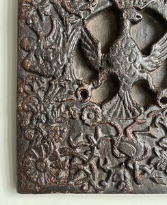 An interesting 17th Century Carved Oak Panel that once would have been the door off of a piece of furniture. The hinge and escutcheon marks are still visible on the reverse. The center sees a crowned eagle surrounded by climbing roses with four larger roses in each corner. Look closer and you'll see other birds and a cupid within the foliage - SHOP NOW - www.intovintage.co.uk