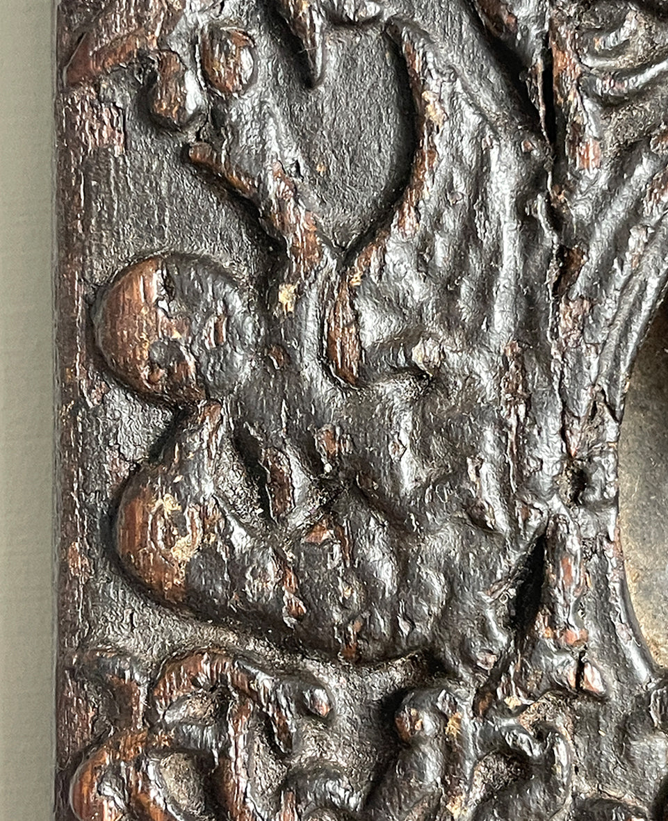 An interesting 17th Century Carved Oak Panel that once would have been the door off of a piece of furniture. The hinge and escutcheon marks are still visible on the reverse. The center sees a crowned eagle surrounded by climbing roses with four larger roses in each corner. Look closer and you'll see other birds and a cupid within the foliage - SHOP NOW - www.intovintage.co.uk