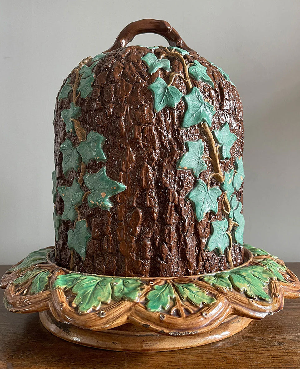 An unusual Victorian Majolica ware Stilton Cheese Keeper. The top dome is decorated in an oak bark design with sprigs of green ivy growing up the sides and a styled branch handle. The base sees an oak leaf pattern with an entwined branch design - SHOP NOW - www.intovintage.co.uk