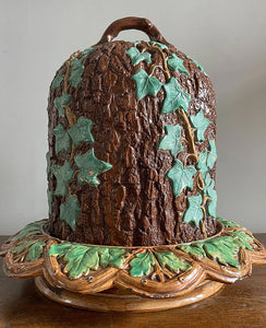 An unusual Victorian Majolica ware Stilton Cheese Keeper. The top dome is decorated in an oak bark design with sprigs of green ivy growing up the sides and a styled branch handle. The base sees an oak leaf pattern with an entwined branch design - SHOP NOW - www.intovintage.co.uk