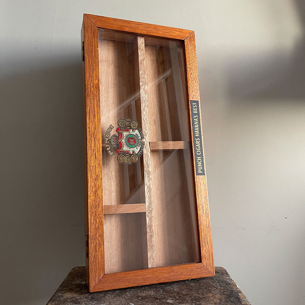 A Vintage mahogany Punch Cigar Display Case with 4 compartments. The glass hinged lid displays the Manuel Lopez Punch crest whilst the frame shows the legend 'Punch Cigars Havana's Best' - SHOP NOW - www.intovintage.co.uk