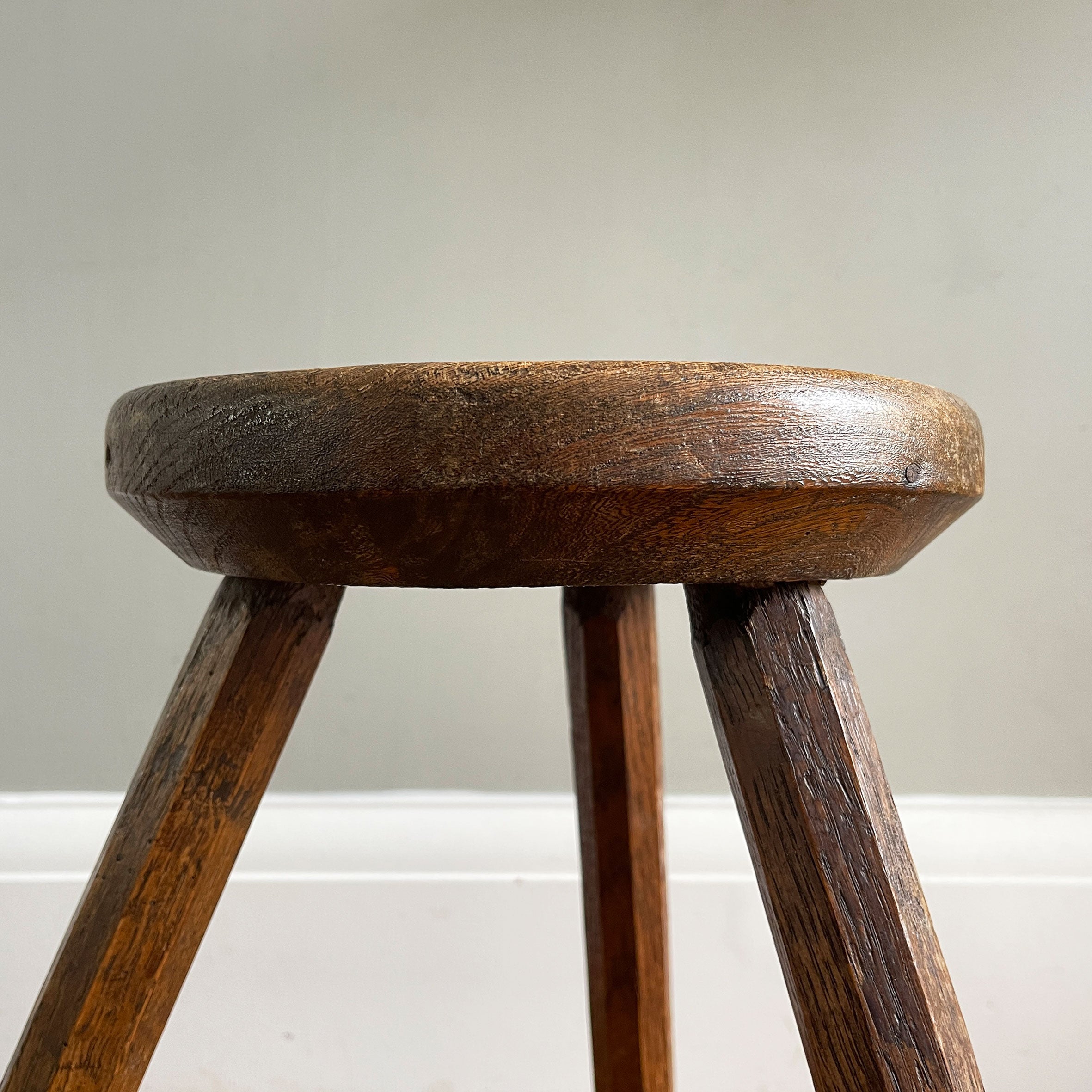 An Antique Elm Oak Milking Stool with a good deep turned Elm seat. Sitting on three octagonal shaped oak legs that can be seen through the seat base. A beautiful piece and very solid - SHOP NOW - www.intovintage.co.uk