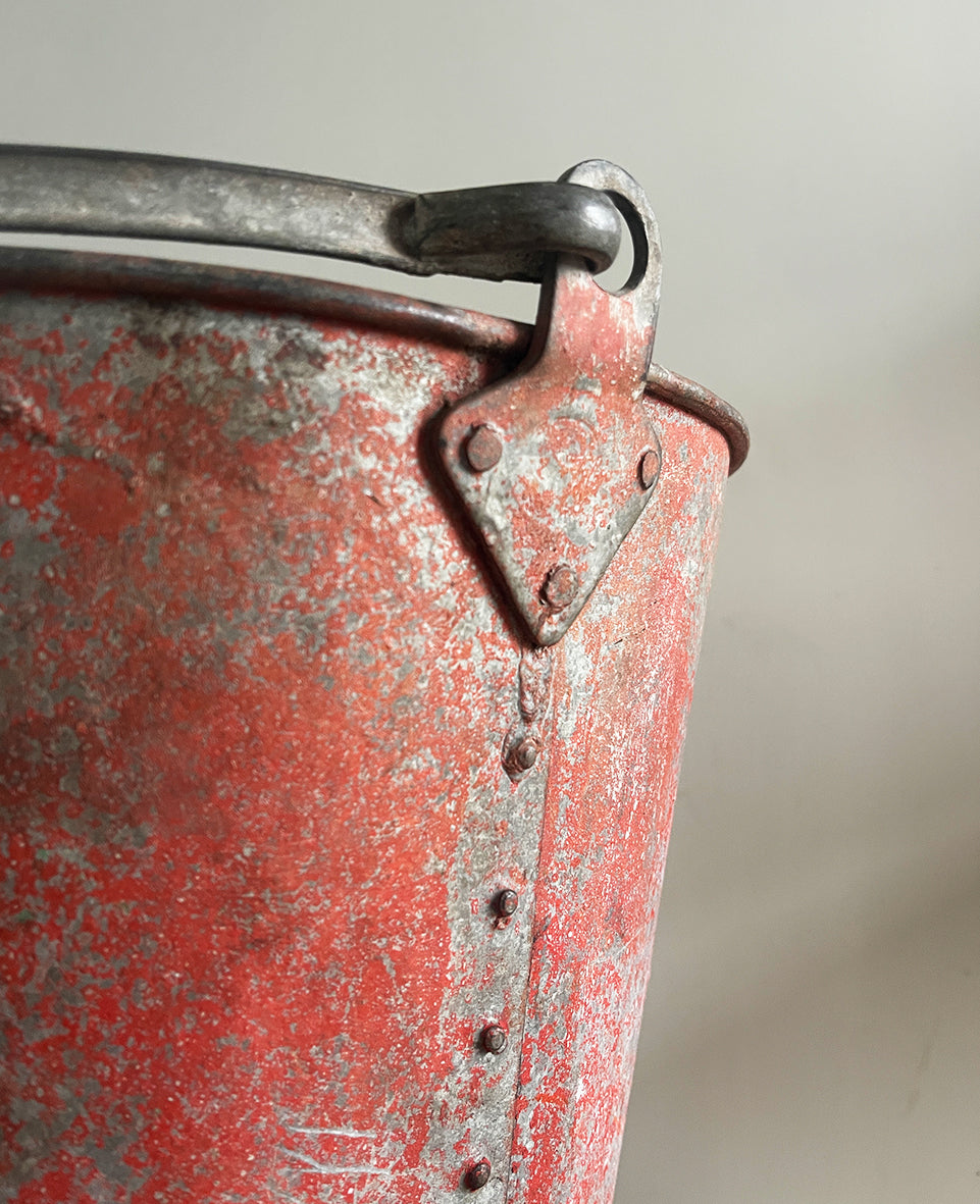 Vintage riveted, galvanised steel fire bucket with a wonderful distressed patina to it's red surface - SHOP NOW - www.intovintage.co.uk