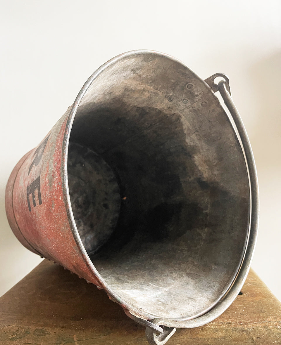 Vintage riveted, galvanised steel fire bucket with a wonderful distressed patina to it's red surface - SHOP NOW - www.intovintage.co.uk