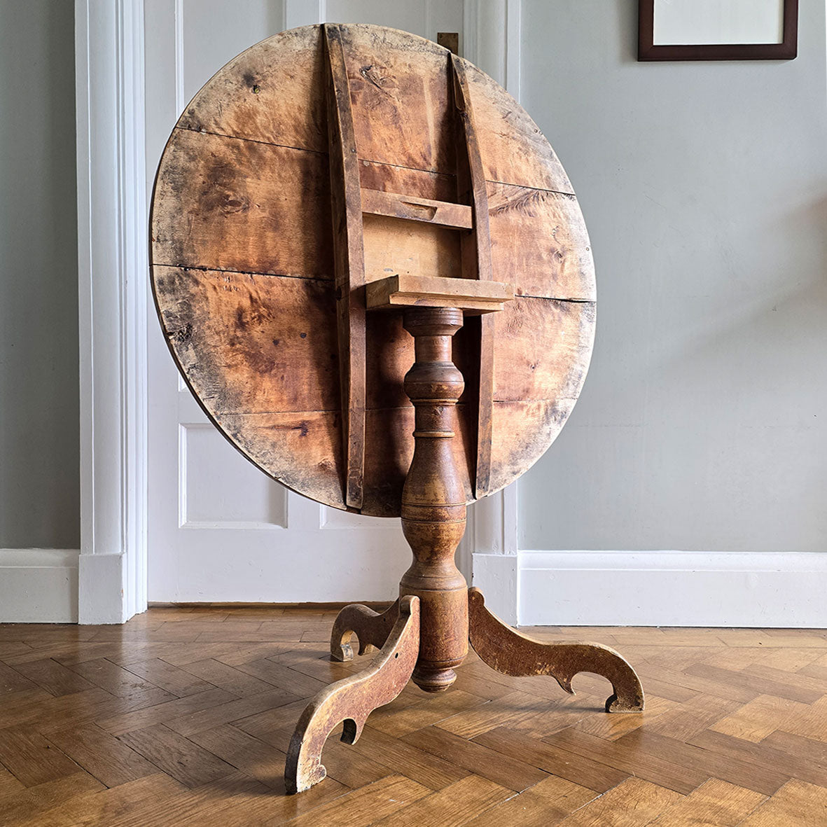 A lovely coloured Rustic French Tilt Top Table. It has a round top raised on three nicely profiled legs and central turned boss. The base still retains its original scumble painted finish. - SHOP NOW - www.intovintage.co.uk