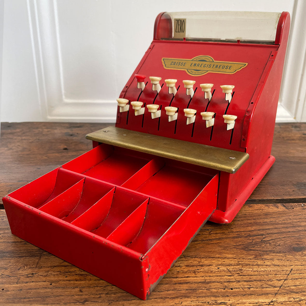 A Charming Children's French toy cash tin plate cash register. Finished in original red paintwork with white keys and a golden Caisse Enregistreuse waterslide decal. - SHOP NOW - www.intovintage.co.uk