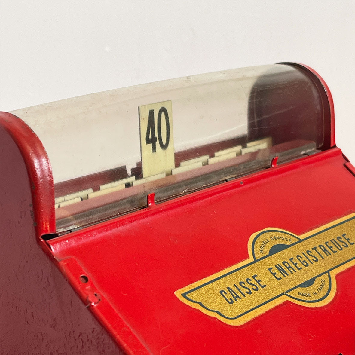 A Charming Children's French toy cash tin plate cash register. Finished in original red paintwork with white keys and a golden Caisse Enregistreuse waterslide decal. - SHOP NOW - www.intovintage.co.uk
