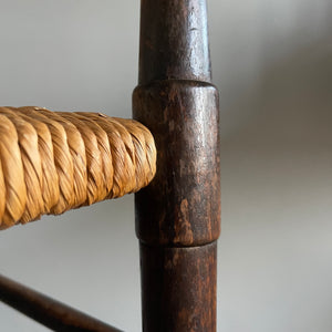 A solid beech Arts and Crafts Chair. Lathe back, rush seat, seven stretchers. Nice patina. A nicely designed and very sturdy chair - SHOP NOW - www.intovintage.co.uk