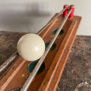 Roll up, Roll up! A Vintage table ball Game of skill. The idea of the challenge is to control the ball with the two metal rods. By parting them as the ball rolls towards you, you must try to deposit the ball in the score holes to achieve the highest score. A lot easier than it sounds!!! - SHOP NOW - www.intiovintage.co.uk