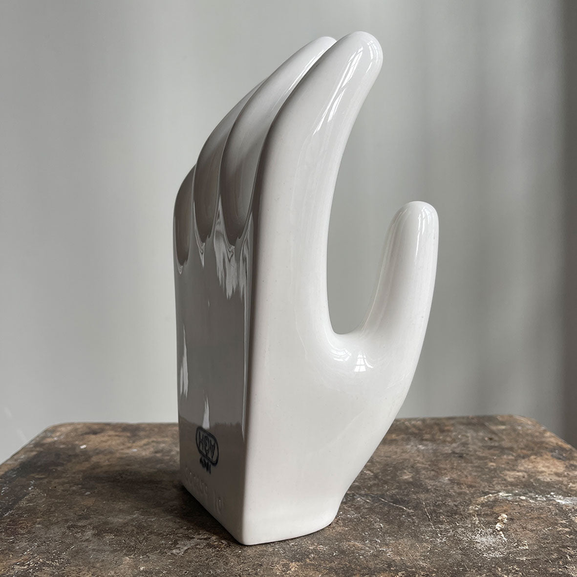 A sculptural Factory Glove Mould. Finished in a white glaze and stamped '300359 10' and 'AGH' printed in blue numerals to the front. In perfect condition - SHOP NOW - www.intovintage.co.uk
