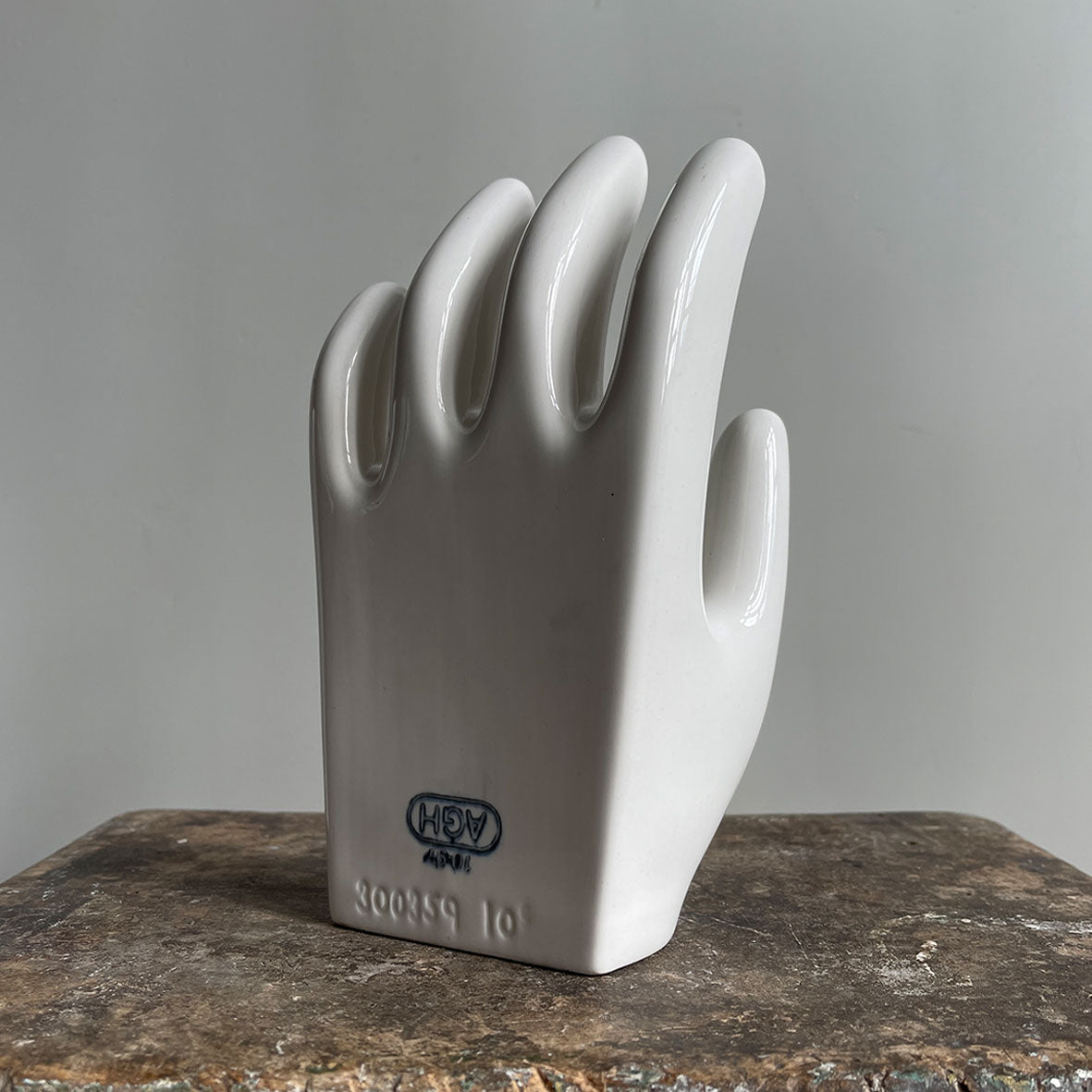 A sculptural Factory Glove Mould. Finished in a white glaze and stamped '300359 10' and 'AGH' printed in blue numerals to the front. In perfect condition - SHOP NOW - www.intovintage.co.uk